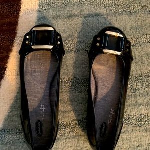 Black patent leather flats.